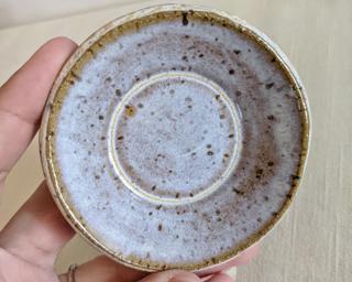 This sweet little dish is made from mid fire brown speckled clay with a creamy white glaze that breaks over the edges, really highlighting the speckles underneath Its the perfect piece to hold your rings or loose change.