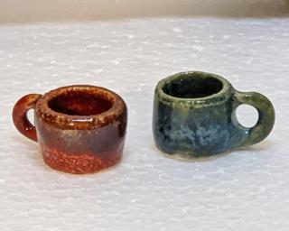 Have you ever seen mugs so small before? These would make a great addition to one's doll house accessories' collection.