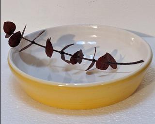 A lovely little yellow and white dish for your dresser. Small cracks on bottom