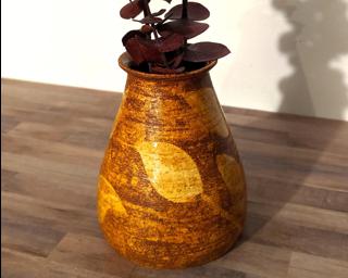 Welcome fall in your home with this one of a kind leafy flower vase.