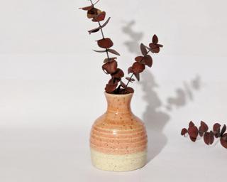 Adorn your home with this pink speckled vase.