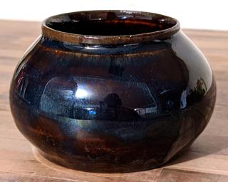Adorn your home with this stunning little planter with a deep blue glaze.