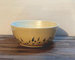 Adorn your home with this sweet serving bowl painted with little blue and purple lavender .