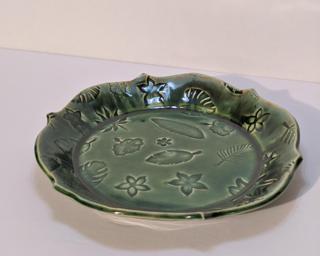 A sweet floral stamped dish for your dresser.