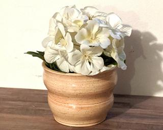 Adorn your home with this one of a kind specked planter.