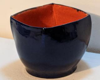 Adorn your home with this deep sapphire blue (exterior) and bright orange (interior) squared planter.