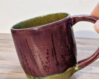 A lovely ceramic mug with little lavender flowers stamped around the outside.