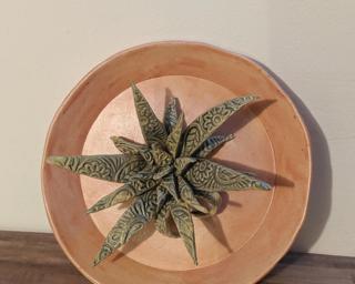 This pink ring dish with a stamped aloe plant would make such a sweet little addition to your dresser.