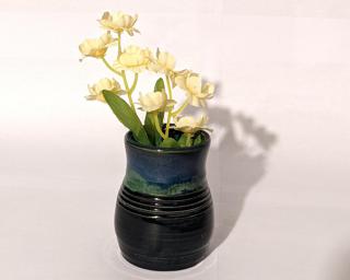 Adorn your home with this one of a kind vase. Small chip at bottom