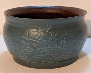 Adorn your home with this one of a kind carved planter.