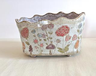 Accentuate your plant collection with this one of a kind piece.