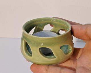 A lovely little summer candle holder for your table. Small crack on bottom