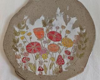 Use this handmade ceramic cheese and cracker board at your next gathering and its sure to be a hit.