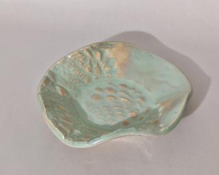 A sweet little textured dish for your dresser.