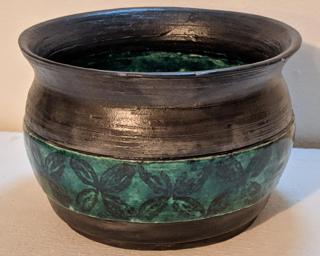 Adorn your home with this one of a kind stamped planter.