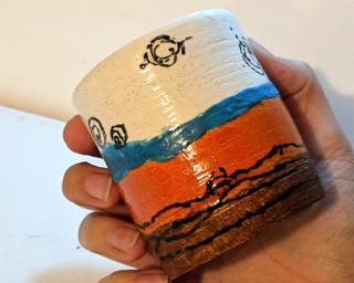 Add to your cup collection with this hand-painted tumbler.