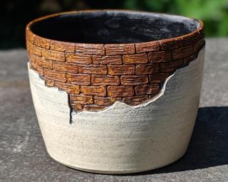 Adorn your home with this one of a kind glazed planter.