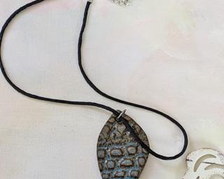 A lovely leaf pendant texture with a lace imprint.