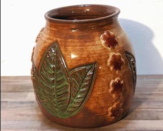 Adorn your home with this one of a kind little carved vase.