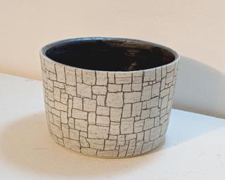 Adorn your home with this one of a kind glazed planter.