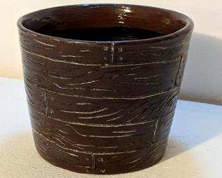 Adorn your home with this one of a kind glazed planter.