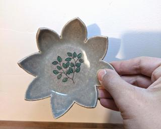 A sweet little flower dish for your dresser.