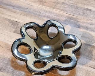 A sweet little abstract flower dish for your dresser.