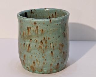 Adorn your home with this blue and brown speckled planter (or vase).