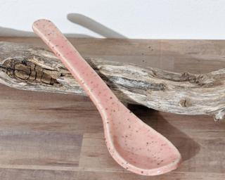 A sweet little handmade spoon with a speckled pink finish.