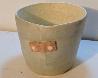 Adorn your home with this unique 'fixed' planter.