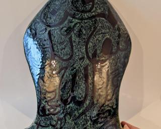 This large hand built decorative piece is sure to catch anyone's eye.