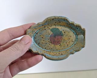 This sweet little dish is made from mid fire brown speckled clay with a light blue glaze, finished with a ginkgo leaf decal.