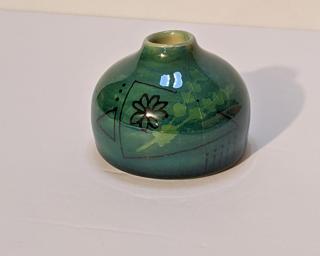 A sweet little vase for your shelf.
