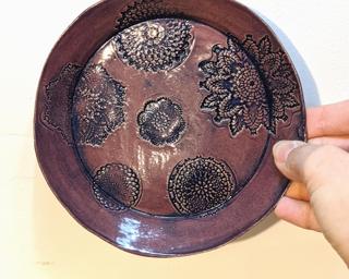 A sweet little flower dish for your dresser.