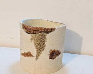 Adorn your home with this one of a kind glazed planter.