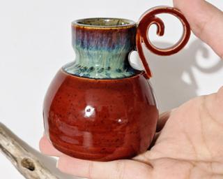 Adorn your home with this one of a kind little vase.