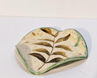 A sweet little dish for your shelf.