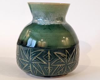 Adorn your home with this one of a kind vase. Glaze crawling on inside (does not leak)