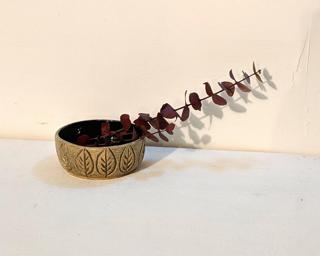 Adorn your home with this one of a kind little glazed planter.