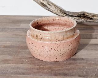 Adorn your home with this one of a kind specked planter.