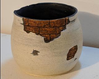 Adorn your home with this one of a kind glazed ceramic planter.