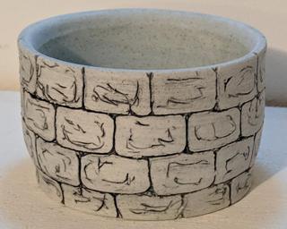 Adorn your home with this one of a kind glazed ceramic planter.