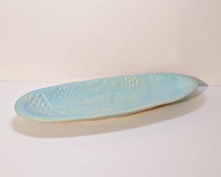 This long textured lace dish would look lovely on anyone's table. Small cracks