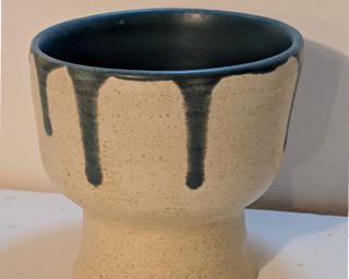 Adorn your home with this unique goblet-like planter.