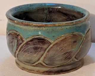 Adorn your home with this one of a kind carved planter.