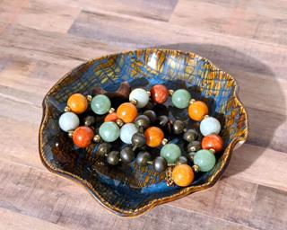 A sweet little textured dish for your dresser.