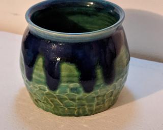 Adorn your home with this one of a kind glazed planter.