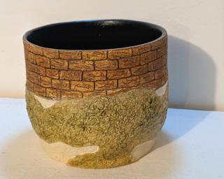 Adorn your home with this one of a kind glazed planter.