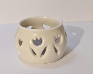 A lovely little summer candle holder for your table. Small cracks at the bottom but still completely functional.