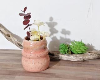 Adorn your home with this pink speckled vase.